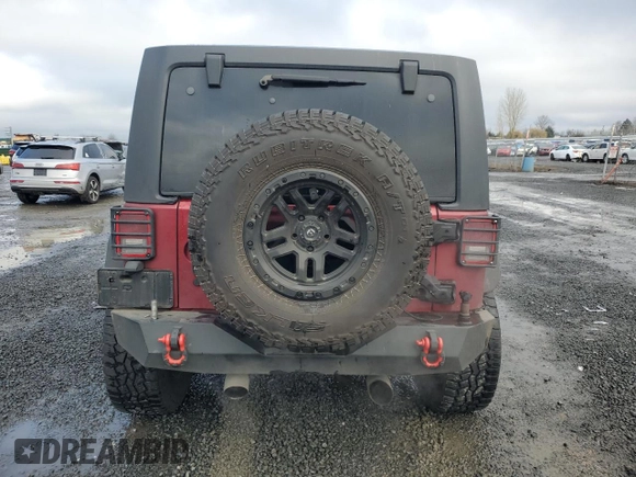2012 Jeep Wrangler Unlimited Rubicon with VIN 1C4HJWFG2CL219021, listed as a Copart auction lot 87451784 with 109,675 mi miles and Salvage title. Bid and sale history available at DreamBid. Image 6.