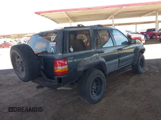 1994 Jeep Grand Cherokee Laredo with VIN 1J4GZ58S4RC280650, listed as a IAAI auction lot 42041261 with 199,265 mi miles and . Bid and sale history available at DreamBid. Image 4.