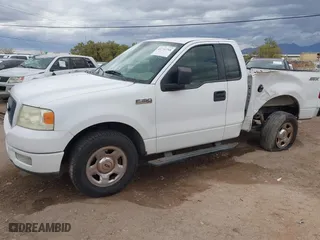 2005 Ford F-150 XL with VIN 1FTRF12W05NB36068, listed as a IAAI auction lot 41732744 with 203,261 mi miles. Bid and sale history available at carsss.com. Image 6.