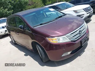 2011 Honda Odyssey Touring with VIN 5FNRL5H97BB067102, listed as a IAAI auction lot 42710464 with 217,369 mi miles and . Bid and sale history available at DreamBid. Image 1.