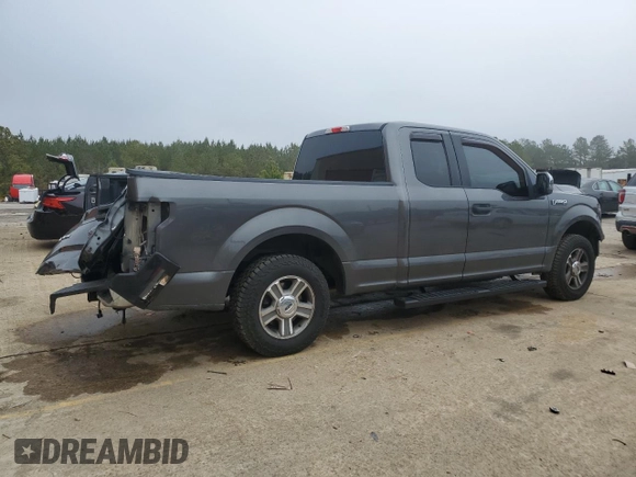 2015 Ford F-150 XL with VIN 1FTEX1C8XFFA48801, listed as a Copart auction lot 43728595 with 144,829 mi miles and Salvage Title. Bid and sale history available at carsss.com. Image 3.