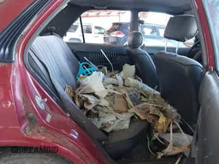 1990 Toyota Corolla z VIN 1NXAE94A1LZ117401, wystawiony jako IAAI lot #41755431 z przebiegiem 81 786 mil mil oraz . Historia ofert i sprzedaży dostępna na DreamBid. Obrazek 8.