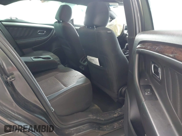 2015 Ford Taurus SEL with VIN 1FAHP2E89FG202589, listed as a IAAI auction lot 41592298 with 105,410 mi miles and . Bid and sale history available at carsss.com. Image 8.