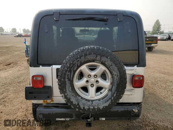 2003 Jeep Wrangler Sport z VIN 1J4FA49S93P306817, wystawiony jako Copart lot #60136385 z przebiegiem 217 208 mil mil oraz Czysty tytuł • Clean title. Historia ofert i sprzedaży dostępna na DreamBid. Obrazek 6.