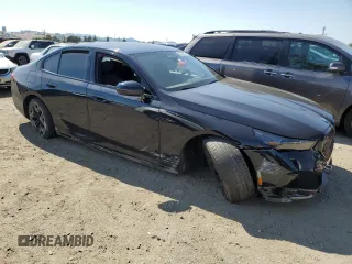 2024 BMW i5 eDrive40 with VIN WBY33FK03RCS14771, listed as a Copart auction lot 62393255 with 25,192 mi miles and Salvage title. Bid and sale history available at DreamBid. Image 4.