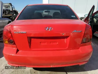 2005 Hyundai Accent GLS with VIN KMHCG45C15U596671, listed as a Copart auction lot 74834004 with 0 mi miles and Salvage Title. Bid and sale history available at carsss.com. Image 6.