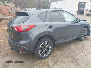 2016 Mazda CX-5 Grand Touring with VIN JM3KE4DY1G0743897, listed as a IAAI auction lot 41935796 with 167,150 mi miles and . Bid and sale history available at carsss.com. Image 4.