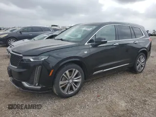 2020 Cadillac XT6 FWD Premium Luxury с VIN 1GYKPCRS8LZ125400, выставлен на аукционе Copart как лот 51339095 с пробегом 89 973 миль миль и Чистый • Clean title. История ставок и продаж доступна на DreamBid. Изображение 1.