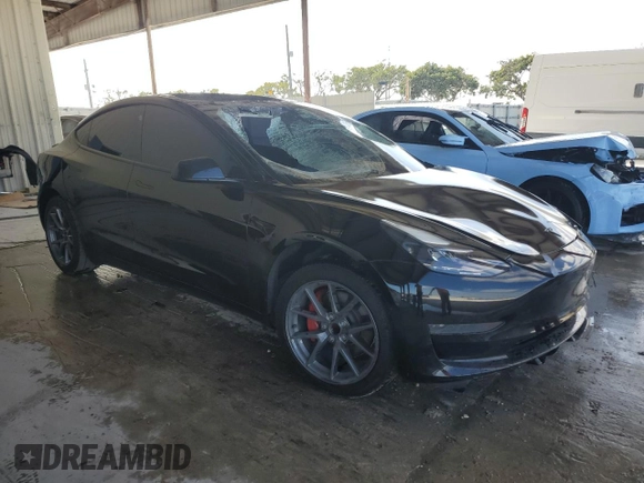 2021 Tesla Model 3 Standard Range Plus with VIN 5YJ3E1EA2MF048564, listed as a Copart auction lot 88754285 with 57,894 mi miles and Non Repairable. Bid and sale history available at DreamBid. Image 4.