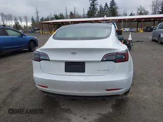 2021 Tesla Model 3 Long Range with VIN 5YJ3E1EB3MF856009, listed as a IAAI auction lot 41809767 with 42,072 mi miles. Bid and sale history available at carsss.com. Image 17.