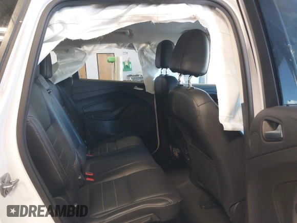 2016 Ford Escape Titanium with VIN 1FMCU9J94GUC28648, listed as a IAAI auction lot 42043761 with 82,509 mi miles and . Bid and sale history available at DreamBid. Image 8.
