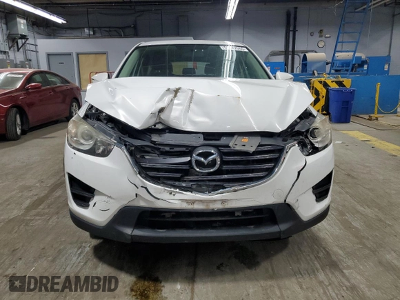2016 Mazda CX-5 Sport with VIN JM3KE4BY9G0694709, listed as a Copart auction lot 55147555 with 98,900 mi miles and Salvage title. Bid and sale history available at DreamBid. Image 5.