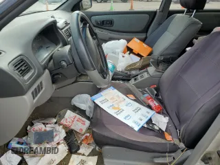 1999 Subaru Impreza L with VIN JF1GF4351XH815210, listed as a Copart auction lot 71250504 with 141,806 mi miles and Salvage title. Bid and sale history available at DreamBid. Image 7.