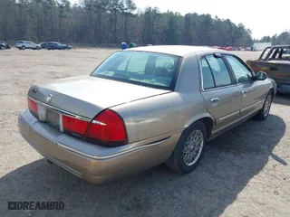 2002 Mercury Grand Marquis GS with VIN 2MEFM74WX2X659583, listed as a IAAI auction lot 41792673 with 183,449 mi miles. Bid and sale history available at carsss.com. Image 4.