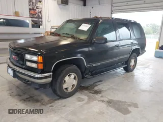 1996 GMC Yukon with VIN 1GKEK13R2TJ743987, listed as a IAAI auction lot 41652826 with 325,292 mi miles. Bid and sale history available at carsss.com. Image 2.