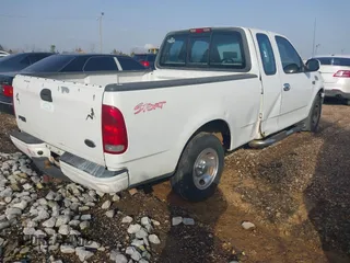 2000 Ford F-150 XL with VIN 1FTZX1729YNC01295, listed as a IAAI auction lot 41298499 with 1 mi miles. Bid and sale history available at carsss.com. Image 4.