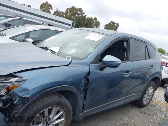 2016 Mazda CX-5 Touring z VIN JM3KE2CY2G0699138, wystawiony jako IAAI lot #42153228 z przebiegiem 144 191 mil mil oraz . Historia ofert i sprzedaży dostępna na DreamBid. Obrazek 14.