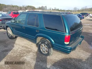 1997 Oldsmobile Bravada z VIN 1GHDT13W9V2705528, wystawiony jako IAAI lot #41583837 z przebiegiem 284 281 mil mil oraz . Historia ofert i sprzedaży dostępna na DreamBid. Obrazek 3.