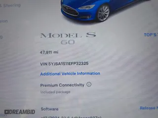 2014 Tesla Model S 60 kWh Battery with VIN 5YJSA1S11EFP32325, listed as a IAAI auction lot 40823219 with 47,911 mi miles. Bid and sale history available at carsss.com. Image 14.