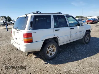 1998 Jeep Grand Cherokee Limited with VIN 1J4GZ78Y0WC307578, listed as a Copart auction lot 45272765 with 328,264 mi miles and Salvage title. Bid and sale history available at DreamBid. Image 3.