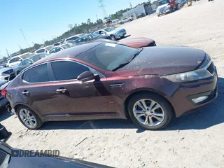 2012 Kia Optima EX with VIN 5XXGN4A73CG071036, listed as a IAAI auction lot 41849926 with 147,448 mi miles. Bid and sale history available at carsss.com. Image 13.