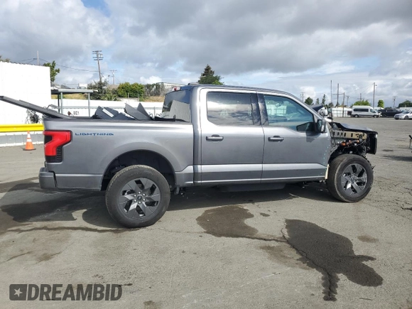 2023 Ford F-150 Lightning Pro with VIN 1FT6W1EV0PWG34788, listed as a Copart auction lot 54454805 with 11,432 mi miles and Salvage title. Bid and sale history available at DreamBid. Image 3.