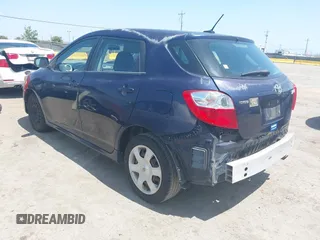 2009 Toyota Matrix with VIN 2T1KU40E99C119135, listed as a IAAI auction lot 42136716 with 185,155 mi miles. Bid and sale history available at carsss.com. Image 3.