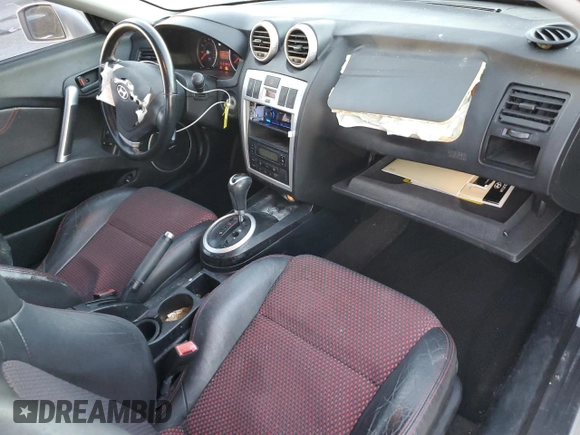 2005 Hyundai Tiburon GT z VIN KMHHN65F05U171038, wystawiony jako Copart lot #87765735 z przebiegiem 113 129 mil mil oraz Szkoda całkowita • Salvage title. Historia ofert i sprzedaży dostępna na DreamBid. Obrazek 8.