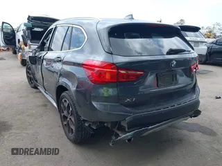 2021 BMW X1 xDrive28i with VIN WBXJG9C03M3M80011, listed as a IAAI auction lot 42137781 with 132,969 mi miles. Bid and sale history available at carsss.com. Image 3.