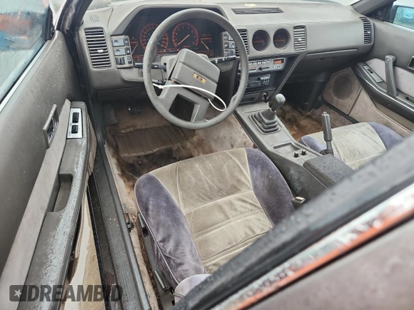 1984 Nissan 300ZX z VIN JN1HZ14S4EX005200, wystawiony jako Copart lot #61509385 z przebiegiem 190 583 mil mil oraz Czysty tytuł • Clean title. Historia ofert i sprzedaży dostępna na DreamBid. Obrazek 8.