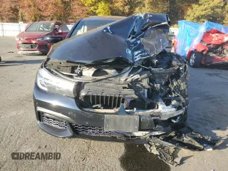 2018 BMW 7 Series 740i xDrive with VIN WBA7E4C53JGV23968, listed as a Copart auction lot 77244814 with 0 mi miles and Salvage Title. Bid and sale history available at carsss.com. Image 5.