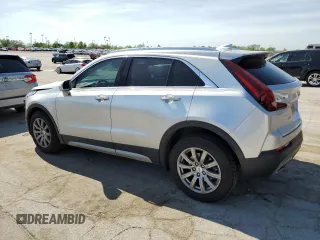 2019 Cadillac XT4 FWD Premium Luxury z VIN 1GYFZCR4XKF224734, wystawiony jako Copart lot #54141975 z przebiegiem 87 633 mil mil oraz Szkody całkowita. Historia ofert i sprzedaży dostępna na DreamBid. Obrazek 2.