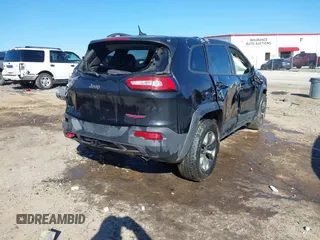 2015 Jeep Cherokee Trailhawk with VIN 1C4PJMBSXFW687737, listed as a IAAI auction lot 40963392 with 119,805 mi miles. Bid and sale history available at carsss.com. Image 4.