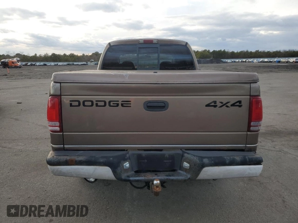 2001 Dodge Dakota z VIN 1B7GG2AX11S108005, wystawiony jako Copart lot #87124934 z przebiegiem 248 482 mil mil oraz Czysty tytuł • Clean title. Historia ofert i sprzedaży dostępna na DreamBid. Obrazek 6.
