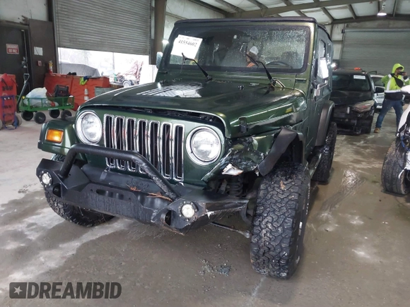 1998 Jeep Wrangler SE with VIN 1J4FY29P2WP733255, listed as a IAAI auction lot 41554602 with 157,316 mi miles. Bid and sale history available at carsss.com. Image 2.