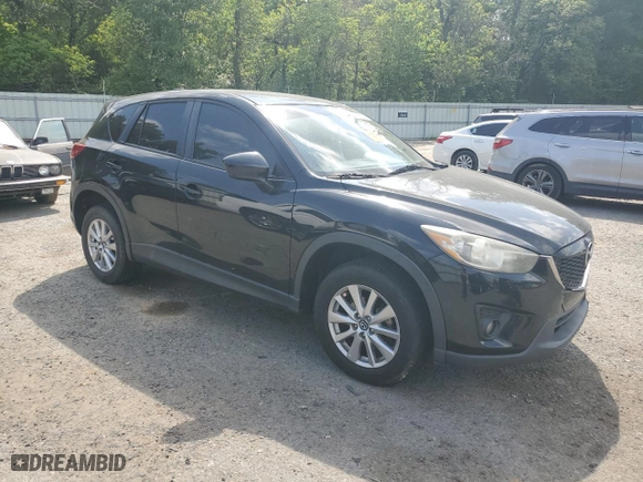 2014 Mazda CX-5 Touring with VIN JM3KE2CY7E0427312, listed as a Copart auction lot 52869335 with 192,903 mi miles and Salvage Title. Bid and sale history available at carsss.com. Image 4.