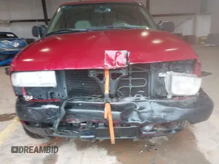 1999 Chevrolet Blazer Trailblazer z VIN 1GNDT13W4X2187490, wystawiony jako IAAI lot #41966073 z przebiegiem 187 604 mil mil oraz . Historia ofert i sprzedaży dostępna na DreamBid. Obrazek 13.