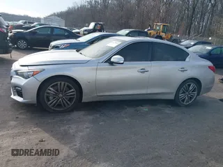 2015 Infiniti Q50 Premium z VIN JN1BV7AR8FM417712, wystawiony jako IAAI lot #41427839 z przebiegiem 88 424 mil mil oraz . Historia ofert i sprzedaży dostępna na DreamBid. Obrazek 13.