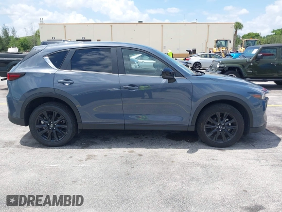 2024 Mazda CX-5 S Carbon Edition z VIN JM3KFBCLXR0521353, wystawiony jako IAAI lot #42351444 z przebiegiem 17 270 mil mil oraz . Historia ofert i sprzedaży dostępna na DreamBid. Obrazek 13.