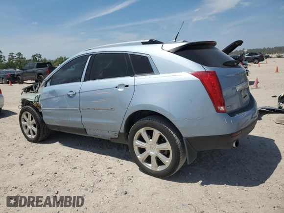 2013 Cadillac SRX Performance Collection with VIN 3GYFNDE37DS535759, listed as a Copart auction lot 52620105 with 92,059 mi miles and Salvage title. Bid and sale history available at DreamBid. Image 2.