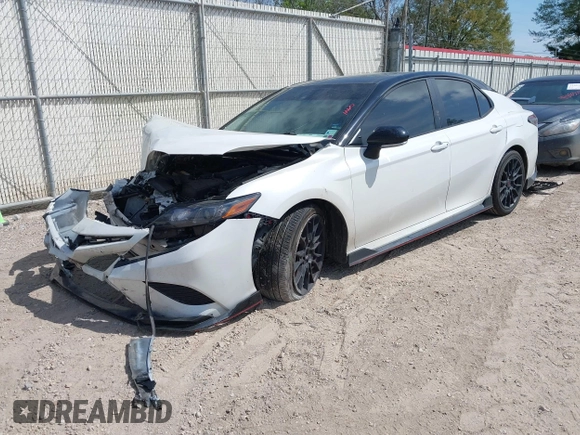 2022 Toyota Camry TRD with VIN 4T1KZ1AK6NU069341, listed as a IAAI auction lot 41881252 with 55,871 mi miles and . Bid and sale history available at DreamBid. Image 2.