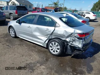 2023 Toyota Corolla Hybrid LE with VIN JTDBCMFE1P3015786, listed as a IAAI auction lot 41887102 with 27,123 mi miles. Bid and sale history available at carsss.com. Image 3.