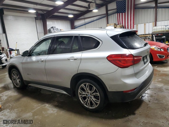 2016 BMW X1 xDrive28i with VIN WBXHT3C32GP880074, listed as a Copart auction lot 87418164 with 99,324 mi miles and Salvage Title. Bid and sale history available at carsss.com. Image 2.