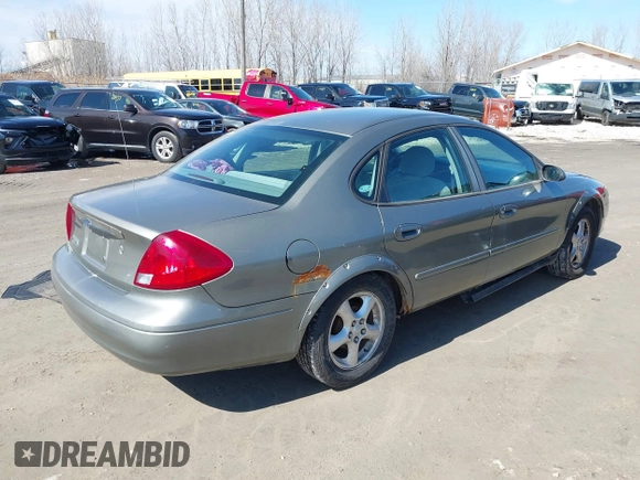 2002 Ford Taurus SES Standard with VIN 1FAFP55UX2G272540, listed as a IAAI auction lot 41874683 with 199,073 mi miles. Bid and sale history available at carsss.com. Image 4.