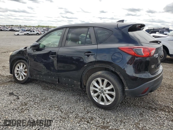 2014 Mazda CX-5 Grand Touring with VIN JM3KE4DY3E0304908, listed as a Copart auction lot 53873655 with 144,382 mi miles and Salvage Title. Bid and sale history available at DreamBid. Image 2.