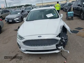 2020 Ford Fusion Titanium с VIN 3FA6P0D98LR151810, выставлен на аукционе IAAI как лот 42590902 с пробегом 76 624 миль миль и . История ставок и продаж доступна на DreamBid. Изображение 12.