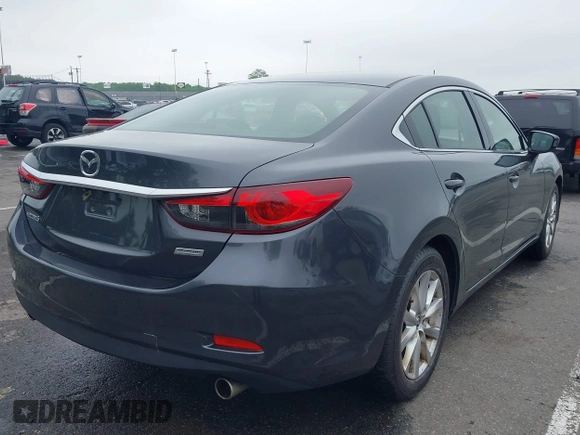 2014 Mazda 6 i Sport with VIN JM1GJ1U52E1102800, listed as a IAAI auction lot 42266283 with 103,886 mi miles and . Bid and sale history available at DreamBid. Image 4.