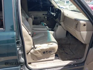 2002 Chevrolet Suburban LT with VIN 1GNEC16Z52J330522, listed as a IAAI auction lot 42251636 with 292,936 mi miles and . Bid and sale history available at DreamBid. Image 5.
