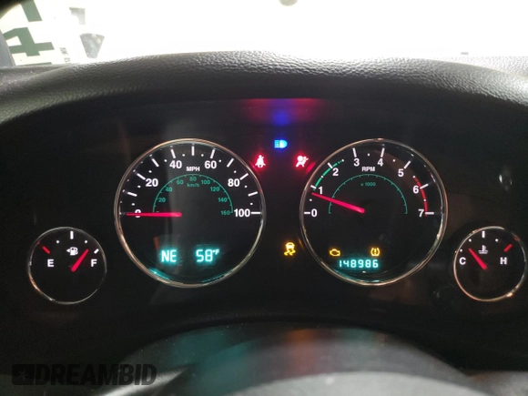 2011 Jeep Wrangler Sahara with VIN 1J4AA5D19BL577347, listed as a Copart auction lot 80340124 with 148,986 mi miles and Salvage Title. Bid and sale history available at DreamBid. Image 9.
