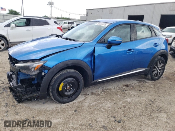 2016 Mazda CX-3 Grand Touring with VIN JM1DKBD72G0106104, listed as a Copart auction lot 52581085 with 76,603 mi miles and Salvage Title. Bid and sale history available at carsss.com. Image 1.